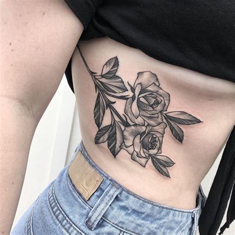 rose ribcage tattoo